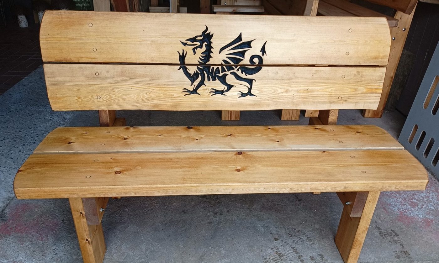 Bench with a Welsh dragon carved into the backrest